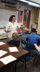 Scientist instructing students during lesson.