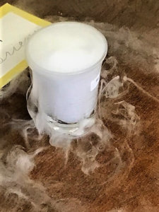 Dry ice in water as the vapor comes out of the container.