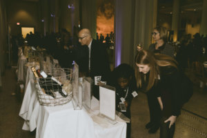 Guests look at the auction items at the STEM gala.