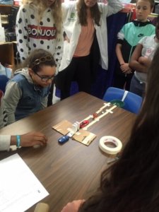 Students build Rube Goldberg devices, learning about simple machines.
