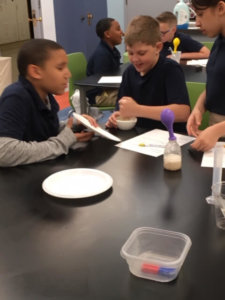 Students investiage food additives as part of an experiment.